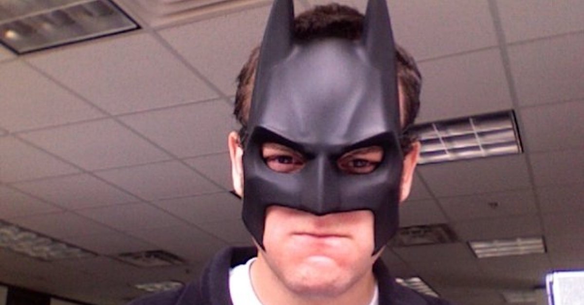 A younger me wearing a Batman mask